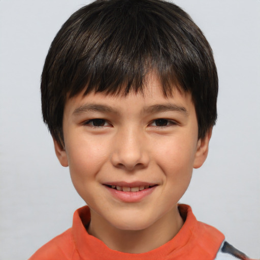 Joyful white child male with short  brown hair and brown eyes