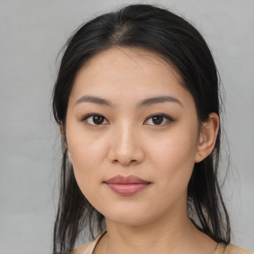 Joyful asian young-adult female with medium  brown hair and brown eyes