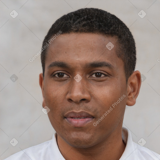 Neutral latino young-adult male with short  black hair and brown eyes
