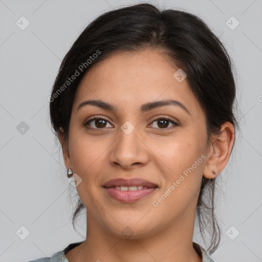 Joyful latino young-adult female with medium  brown hair and brown eyes