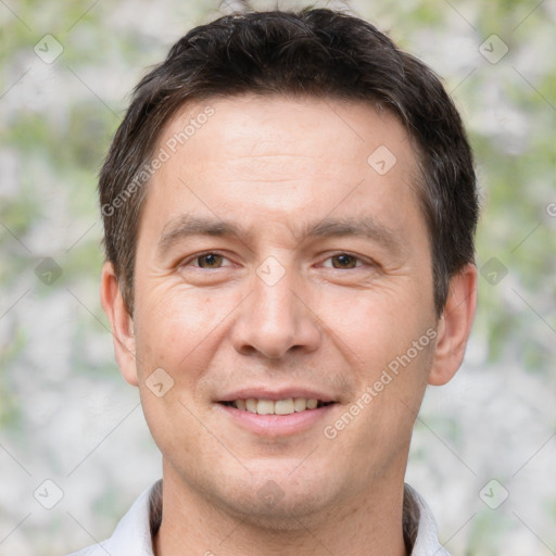 Joyful white adult male with short  brown hair and brown eyes