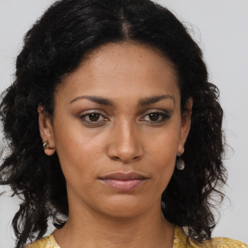 Neutral black young-adult female with medium  brown hair and brown eyes