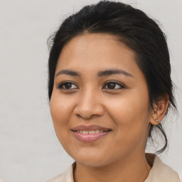 Joyful asian young-adult female with medium  brown hair and brown eyes