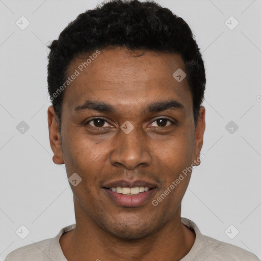 Joyful black young-adult male with short  black hair and brown eyes
