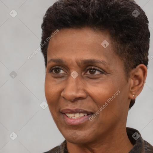 Joyful black adult male with short  brown hair and brown eyes