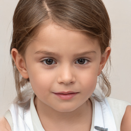 Joyful white child female with medium  brown hair and brown eyes