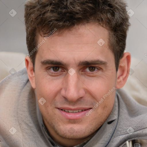 Joyful white adult male with short  brown hair and brown eyes