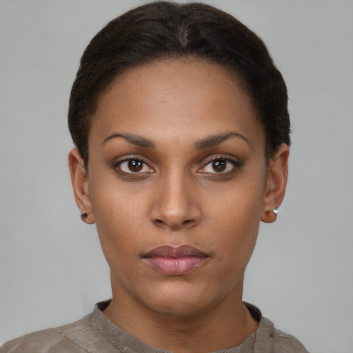 Neutral black young-adult female with short  brown hair and brown eyes