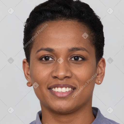 Joyful black young-adult female with short  black hair and brown eyes