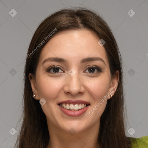 Joyful white young-adult female with long  brown hair and brown eyes