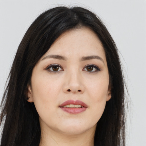 Joyful asian young-adult female with long  brown hair and brown eyes
