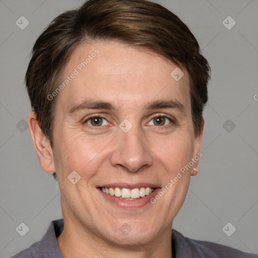 Joyful white adult male with short  brown hair and grey eyes