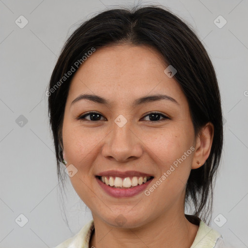 Joyful asian young-adult female with medium  brown hair and brown eyes