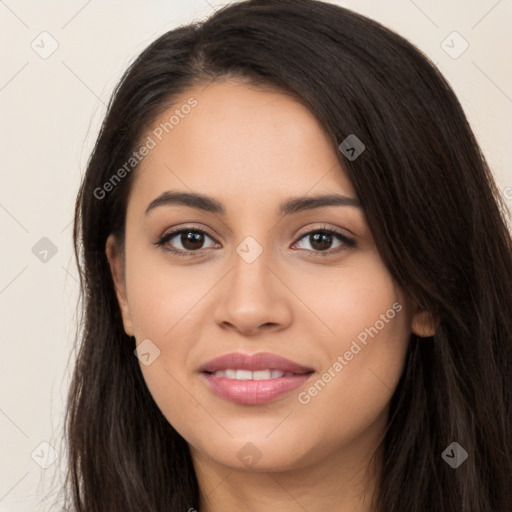 Joyful latino young-adult female with long  brown hair and brown eyes