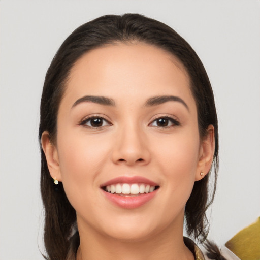 Joyful white young-adult female with long  brown hair and brown eyes