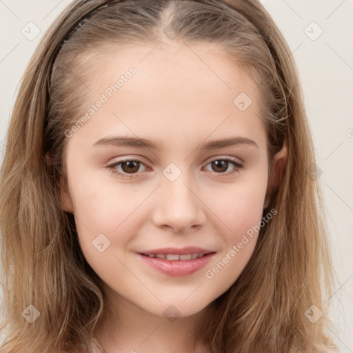 Joyful white child female with long  brown hair and brown eyes