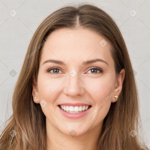 Joyful white young-adult female with long  brown hair and green eyes