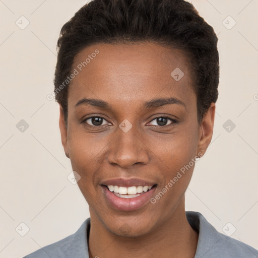 Joyful black young-adult female with short  brown hair and brown eyes