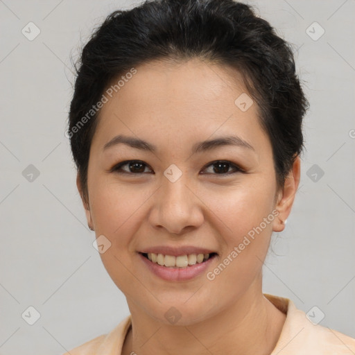 Joyful asian young-adult female with short  brown hair and brown eyes