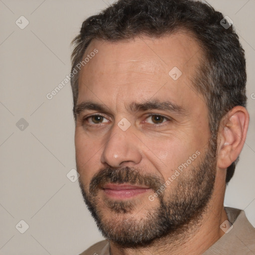 Joyful white adult male with short  black hair and brown eyes