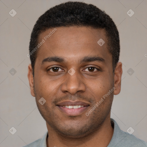 Joyful black young-adult male with short  brown hair and brown eyes