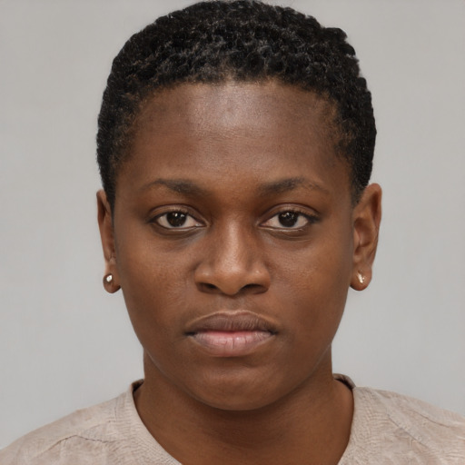 Neutral black young-adult female with short  brown hair and brown eyes
