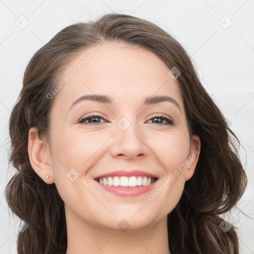 Joyful white young-adult female with long  brown hair and grey eyes