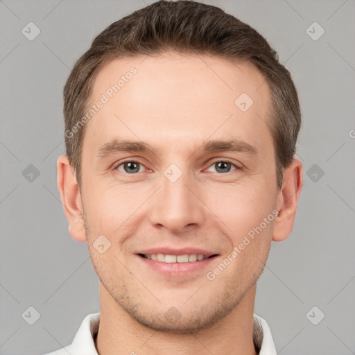 Joyful white young-adult male with short  brown hair and brown eyes