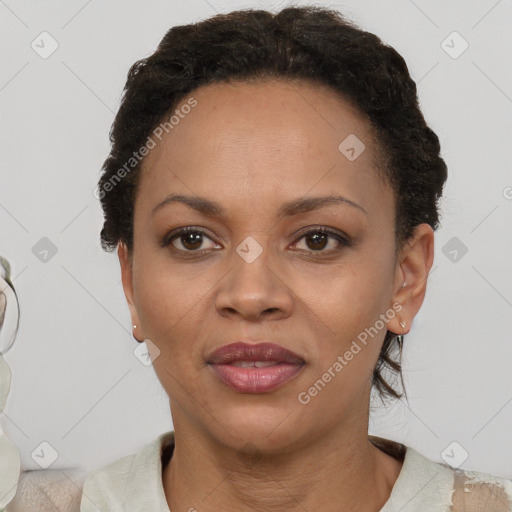 Joyful black adult female with short  brown hair and brown eyes