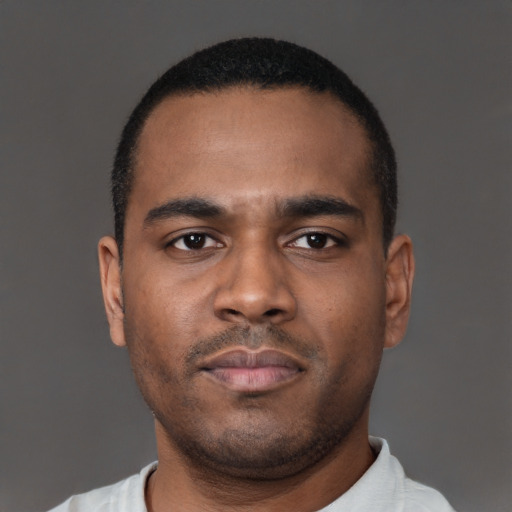 Neutral latino young-adult male with short  brown hair and brown eyes