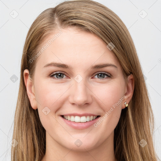 Joyful white young-adult female with long  brown hair and grey eyes