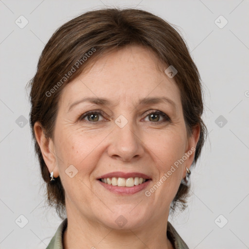 Joyful white adult female with medium  brown hair and grey eyes