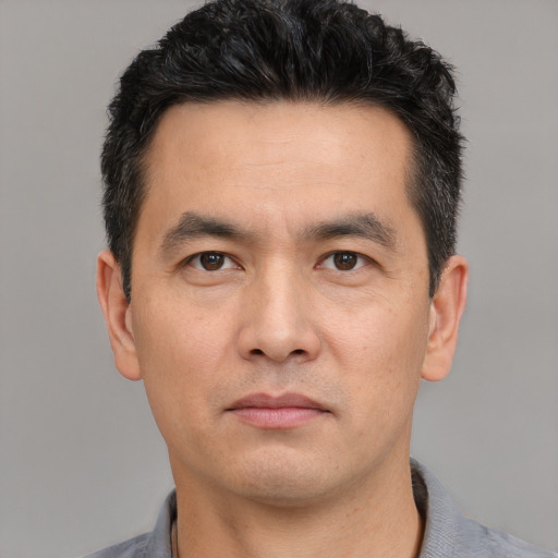 Neutral white young-adult male with short  black hair and brown eyes