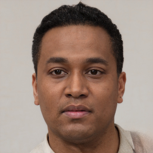 Neutral latino young-adult male with short  black hair and brown eyes