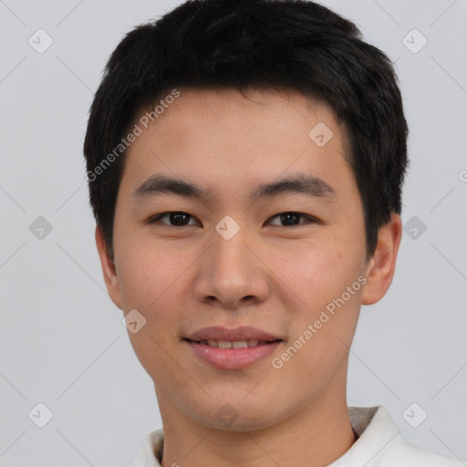 Joyful asian young-adult male with short  black hair and brown eyes