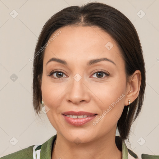 Joyful white adult female with medium  brown hair and brown eyes