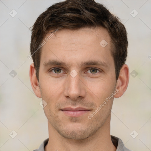 Joyful white young-adult male with short  brown hair and brown eyes