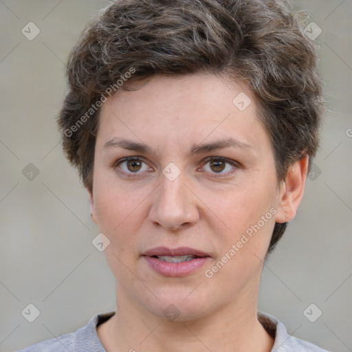 Joyful white adult female with short  brown hair and brown eyes