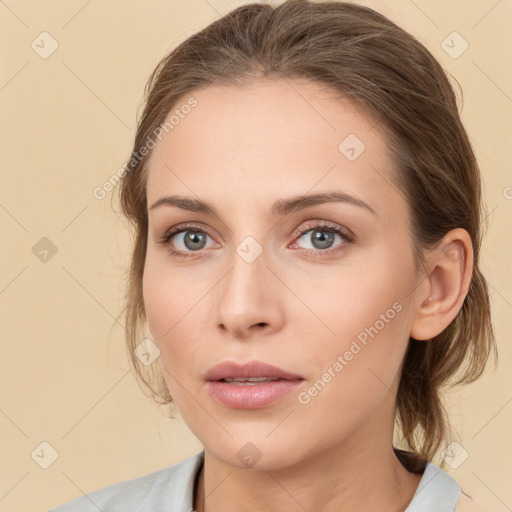 Neutral white young-adult female with medium  brown hair and grey eyes