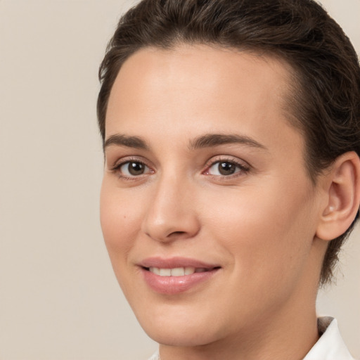 Joyful white young-adult female with medium  brown hair and brown eyes