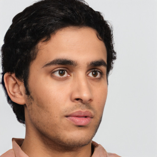 Neutral latino young-adult male with short  brown hair and brown eyes