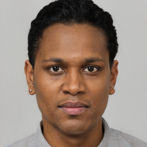 Neutral black young-adult male with short  black hair and brown eyes