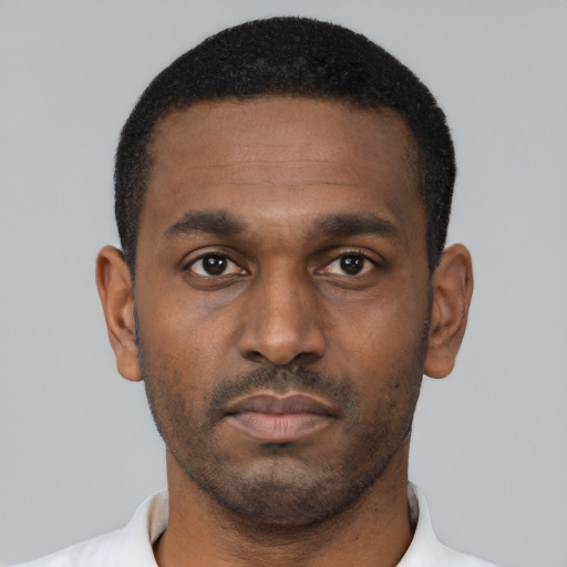 Neutral black young-adult male with short  black hair and brown eyes