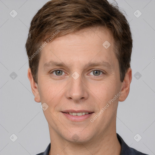 Joyful white adult male with short  brown hair and grey eyes