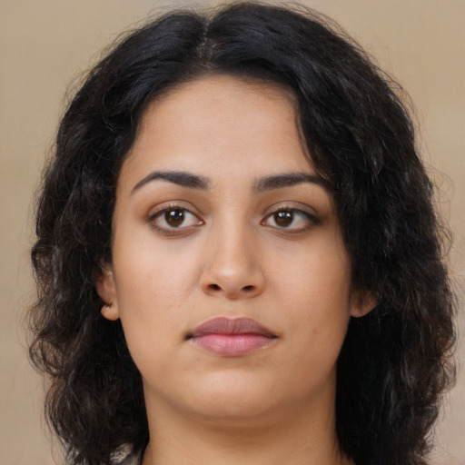 Neutral latino young-adult female with long  black hair and brown eyes