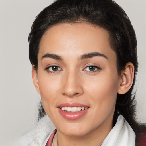 Joyful white young-adult female with medium  black hair and brown eyes