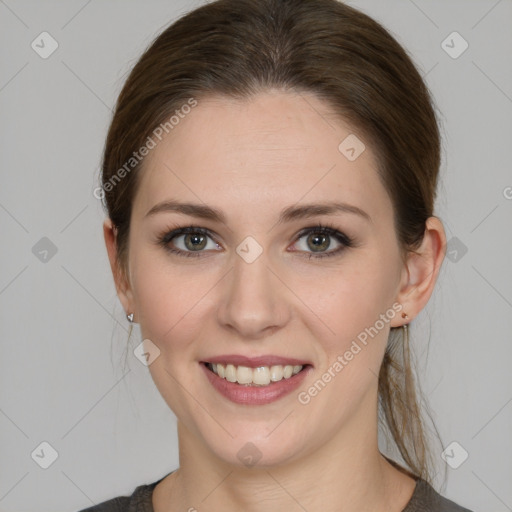 Joyful white young-adult female with medium  brown hair and grey eyes