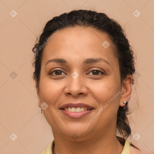 Joyful latino young-adult female with short  brown hair and brown eyes