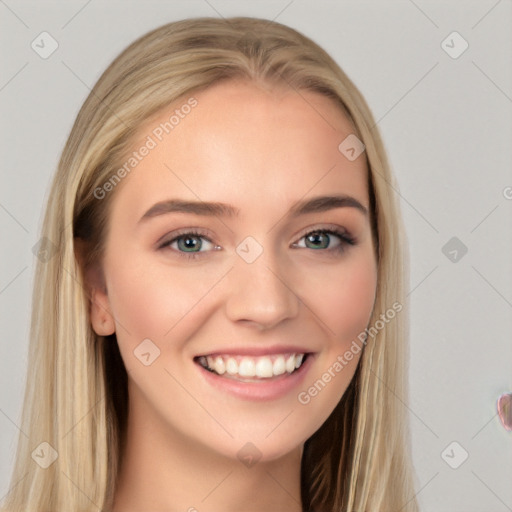 Joyful white young-adult female with long  brown hair and blue eyes