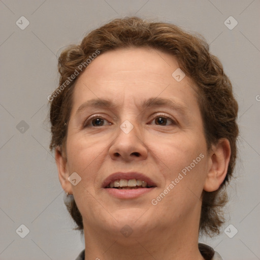 Joyful white adult female with short  brown hair and brown eyes